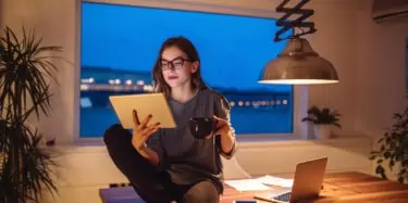 Woman with coffee working from home
